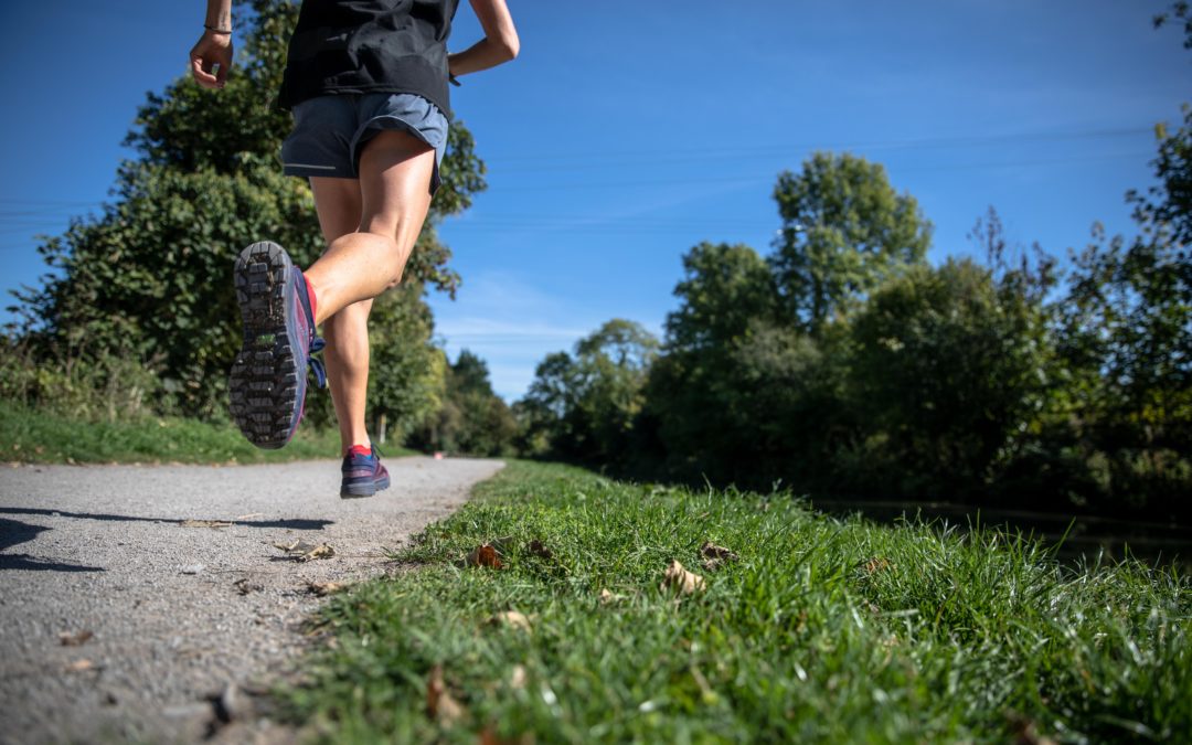 Which running surface is the best to reduce the risk of injury?